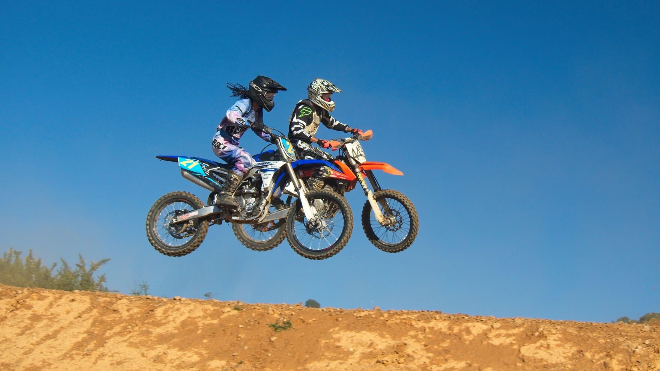 Two riders airborne together