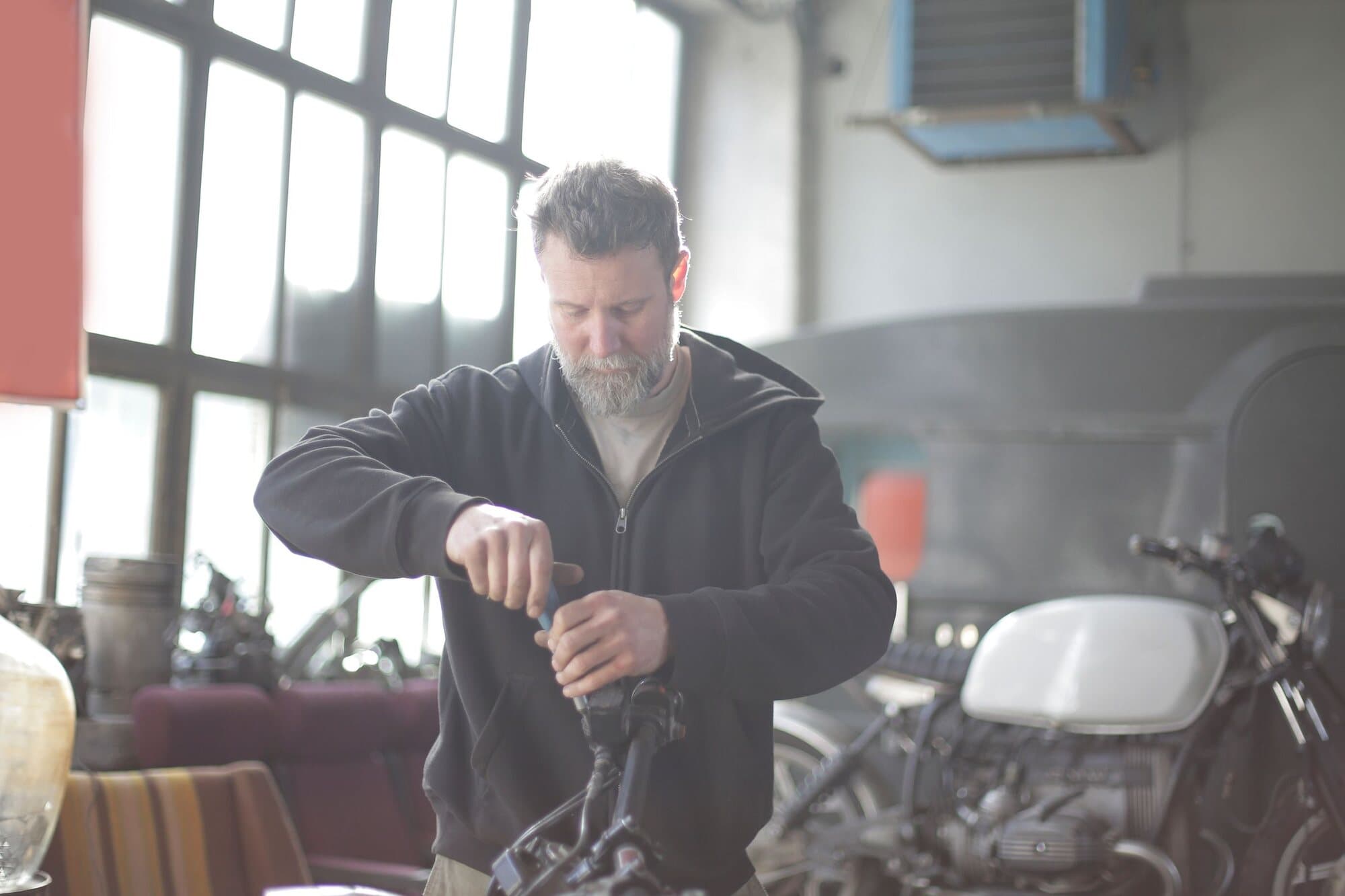 A mechanic working on a bike in the workshop